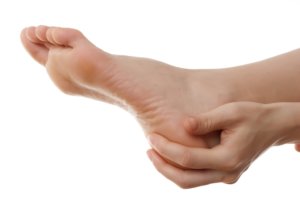 Feet holding by hand due to heel pain