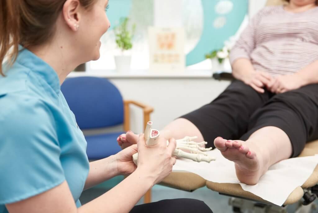 Podiatrist Anna Cooke at Round House Podiatry treating a patient