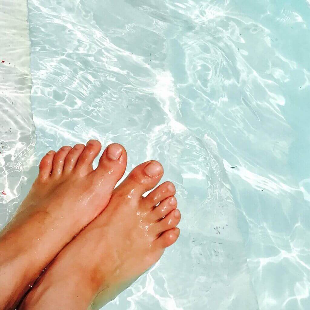 Feet in a swimming pool in Summer , summer feet tips